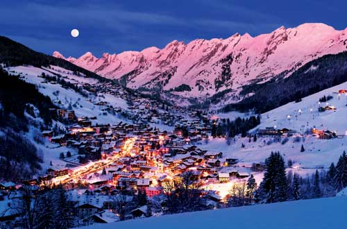 Night Time Skiing and Snowboarding Under the Full Moon in La Clusaz